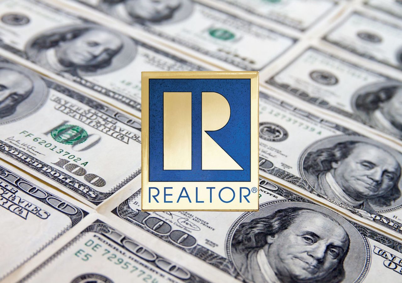 The National Association of Realtors (NAR) logo centered on a background of 100 dollar bills.